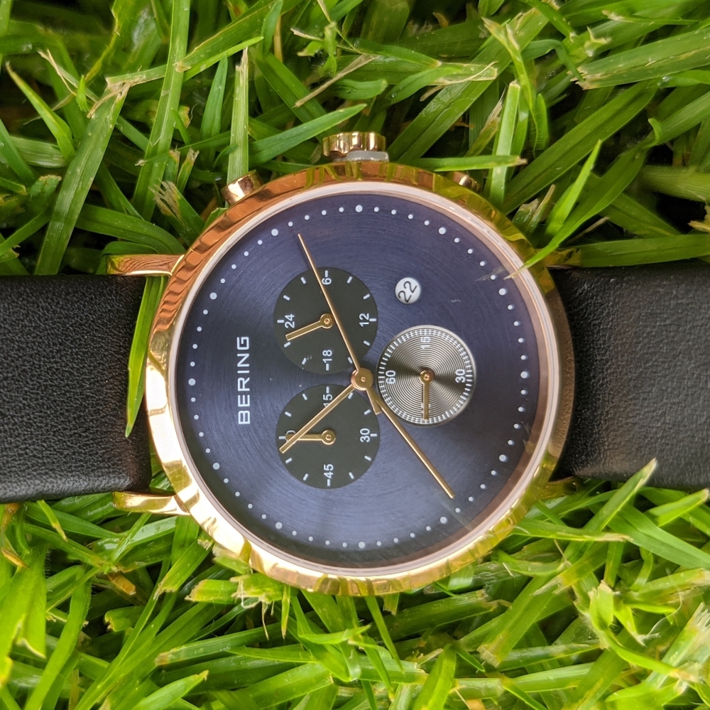 Bering blue and polished gold black leather watch